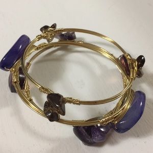 Gold bracelet with purple stones